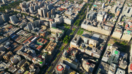 Video - Aerial drone view of central Santiago showcasing government buildings, parks, and a grid of city streets bathed in sunlight
