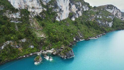 Video - Aerial drone view of the famous marble caves of Patagonia, carved by centuries of water erosion