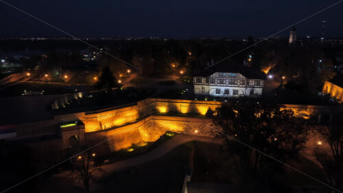 Video – Aerial drone view of Belgrade’s iconic Victor Monument, beautifully lit against the fortress and old architecture at night - Starpik Stock