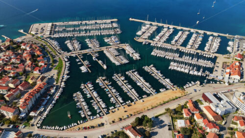 Video – Aerial drone view of Biograd na Moru’s Marina Kornati, one of the largest marinas on the Adriatic. Croatia - Starpik Stock