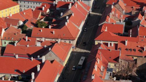 Video – Aerial drone view of Novi Sad old town with red tiled roofs, narrow streets, and traditional architecture. Serbia - Starpik Stock