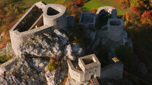 Video – Aerial drone view of Srebrenik Fortress, a medieval stronghold perched dramatically atop a steep rock cliff in Bosnia and Herzegovina - Starpik Stock