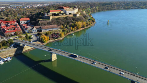 Video – Aerial drone view of Varadin Bridge crossing the Danube River in Novi Sad, Serbia, with Petrovaradin Fortress visible in the background - Starpik Stock