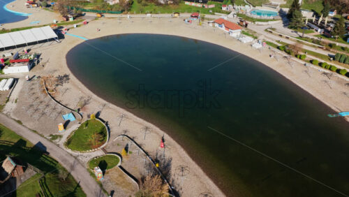 Video – Aerial drone view of the Pannonian Lakes complex in Tuzla, showing the artificial salt lakes, beach areas, walking paths, and recreational zones - Starpik Stock
