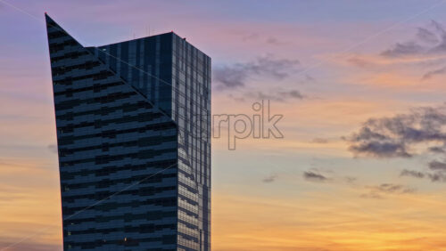 Video – Aerial drone view of the distinctive angular skyscraper, located in Warsaw business district - Starpik Stock