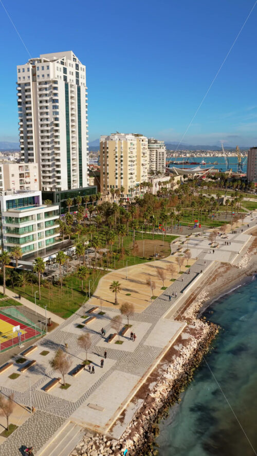 Video – Aerial drone view of the redesigned Lungomare waterfront promenade in Durres, Albania. Vertical - Starpik Stock
