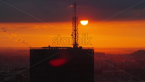 Video – Aerial drone view of the telecommunication antennas on top of Usce Tower during a warm golden sunset in Belgrade, Serbia - Starpik Stock