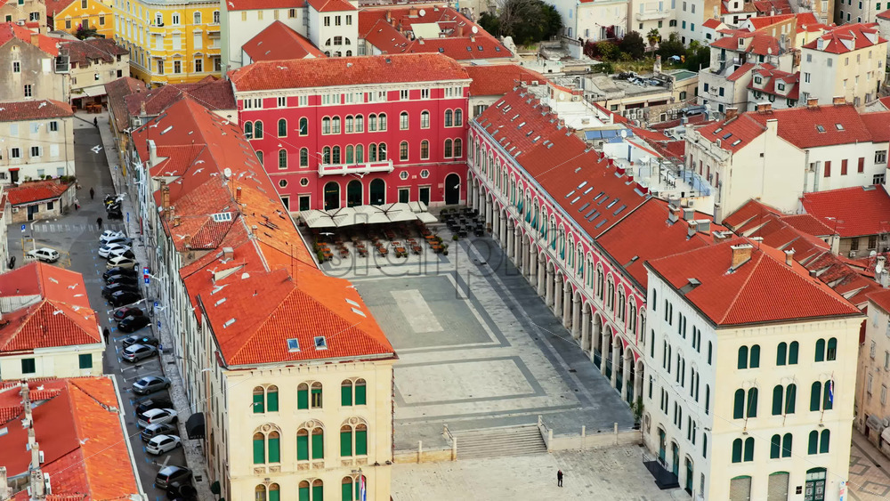 Video – Aerial drone view of the vibrant Republic Square in Split, known for its red Venetian style facades and long arcade - Starpik Stock