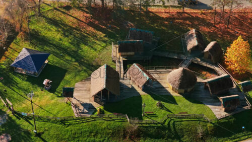 Video – Aerial drone view of the wooden cottages and traditional structures in Tuzla’s ethno village - Starpik Stock
