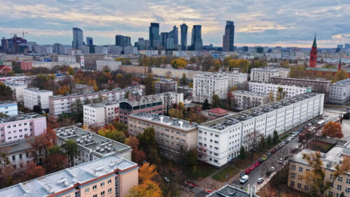 Video – Warsaw, Poland – October 30, 2025: Aerial drone view city skyline in the Srodmiescie and Wola districts, showcasing iconic skyscrapers such as Warsaw Spire, Warsaw UNIT, The Curve, Q22, and Zlota 44 under a cloudy autumn sky - Starpik Stock