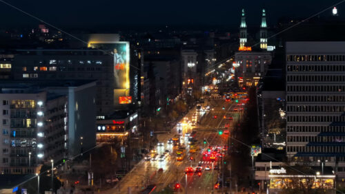 Video – Warsaw, Poland – October 30, 2025: Aerial drone view of Marszalkowska lined with trams, lights, and bustling evening traffic - Starpik Stock