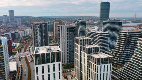 Video - Aerial drone view of the Belgrade Waterfront skyline showcasing luxury residential towers, modern urban development, and the Kula Belgrade tower dominating the background
