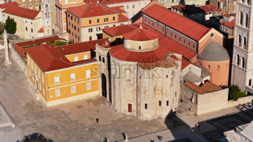 Video - Aerial drone view of the iconic circular Church of St. Donatus, one of Zadar's most famous pre Romanesque landmarks