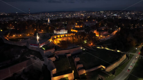 Video - Aerial drone view of Kalemegdan Fortress illuminated in warm lights at night