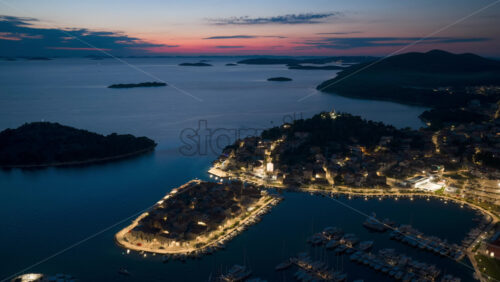 Video - Aerial drone timelapse of Tribunj, Croatia at night, red sky at dawn