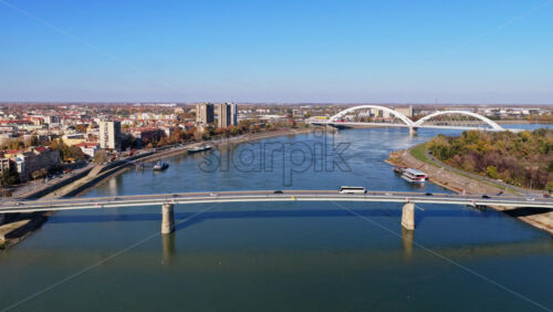 Video - Aerial drone view of Novi Sad featuring the Varadin Bridge, Danube River, and city skyline