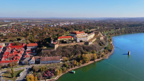 Video - Aerial drone view of the iconic Petrovaradin Fortress in Novi Sad, Serbia, overlooking the Danube River