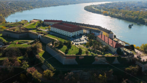Video - Aerial drone view of the Petrovaradin Fortress, one of Serbia's most iconic landmarks, overlooking the Danube. Novi Sad, Serbia