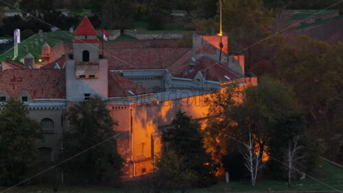Video - Aerial drone view of Kalemegdan's old stone walls glowing under golden hour lighting