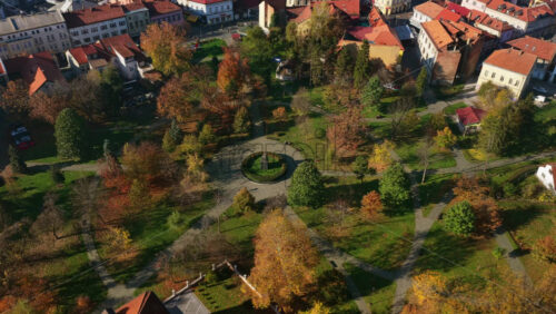 Video - Aerial drone view of a central urban park in Tuzla, Bosnia and Herzegovina, surrounded by the historic Old Town