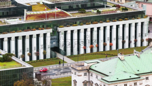 Video - Aerial drone view of the Supreme Court of Poland in Warsaw with urban surroundings and light pedestrian movement