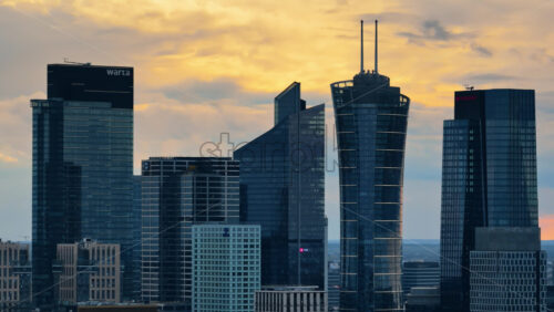 Video - Warsaw, Poland - October 30, 2025: Aerial drone view of the high rise buildings in Wola, Warsaw, including Warsaw Spire, Skyliner, Warsaw UNIT, and the Warta Tower