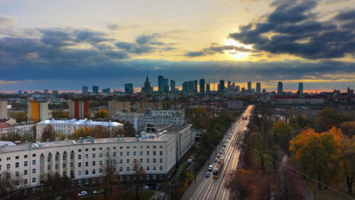 Video - Warsaw, Poland - October 30, 2025: Aerial drone view of Warsaw's entire skyline from a distance, with dramatic skies and long shadows falling across the city