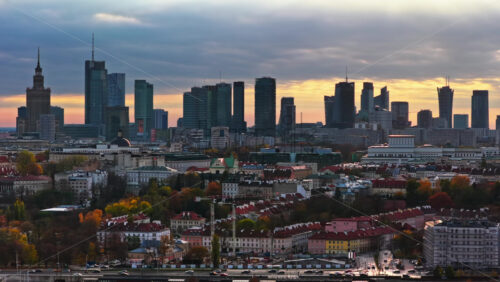 Video - Warsaw, Poland - October 31, 2025: Aerial drone view of the city's central skyline including the Palace of Culture, Warsaw Spire, and assorted modern towers