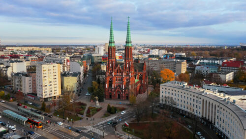 Video - Warsaw, Poland - October 31, 2025: Aerial drone view of the St. Florian Cathedral in Praga Polnoc, showcasing its brick neo Gothic design