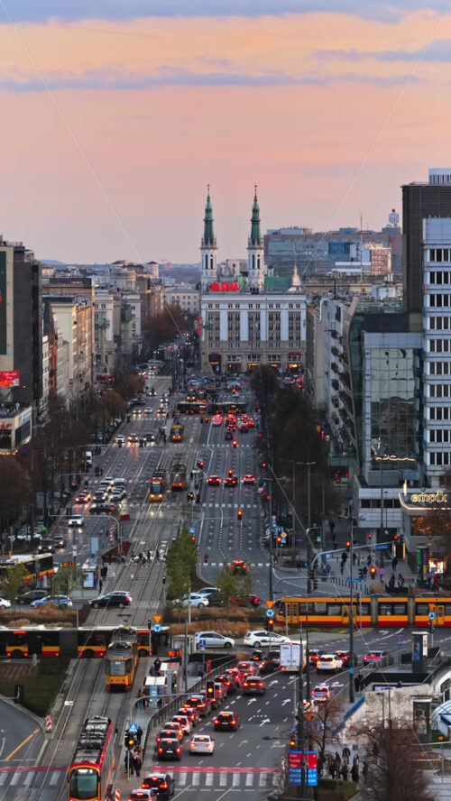 Video - Warsaw, Poland - October 31, 2025: Aerial drone view of Marszalkowska Street heading south toward Plac Konstytucji and the iconic MDM Hotel with its post war Socialist Realist architecture. Vertical