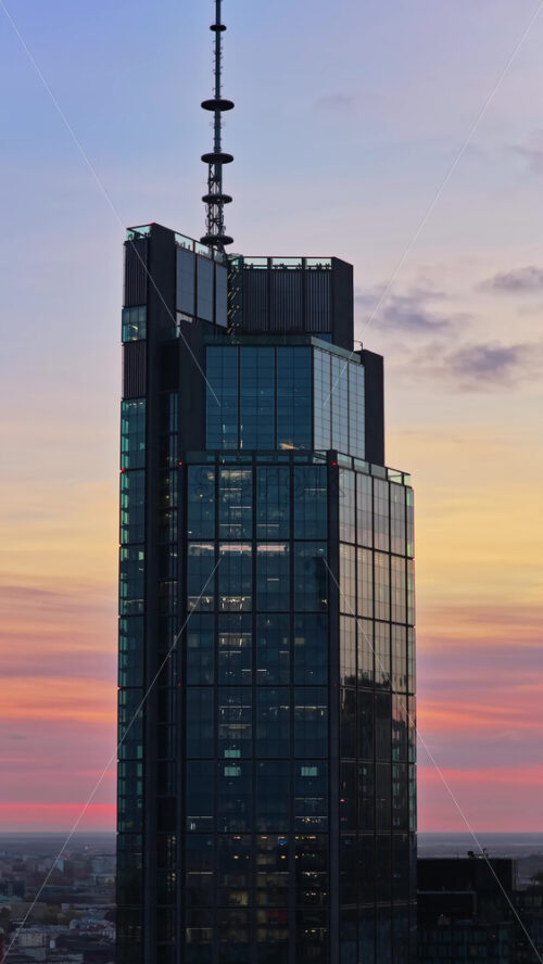 Video - Aerial drone view of the distinctive angular Skyliner skyscraper, located at Rondo Daszynskiego in the rapidly developing Warsaw business district. Vertical
