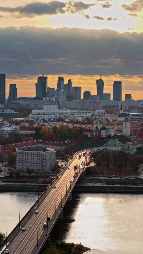 Video - Warsaw, Poland - October 31, 2025: Aerial drone view of the city's central skyline including the Palace of Culture, Warsaw Spire, and assorted modern towers. Vertical