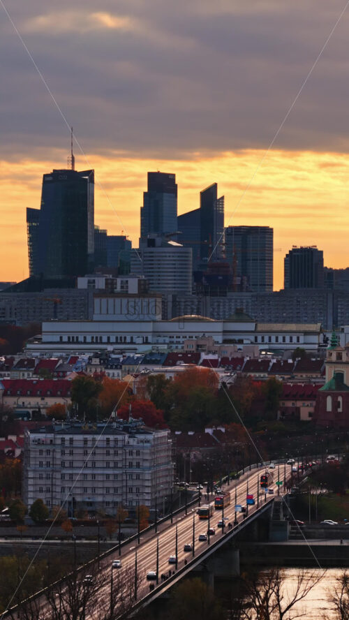 Video - Warsaw, Poland - October 31, 2025: Aerial drone view of the city's central skyline including the Palace of Culture, Warsaw Spire, and assorted modern towers. Vertical