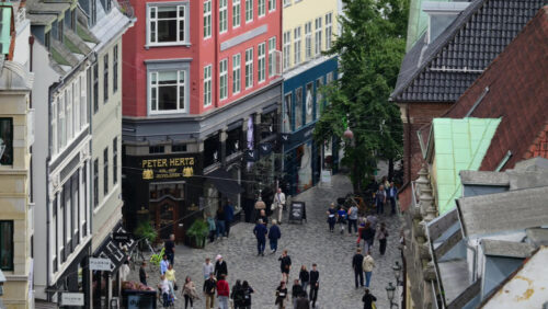 Video - Copenhagen, Denmark - August 4, 2025: Pedestrians filling a busy shopping street with traditional architecture in a vibrant European city