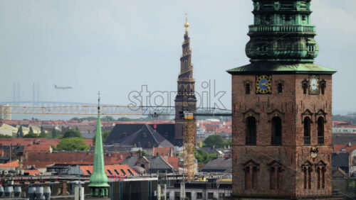 Video - Copenhagen cityscape showcasing historic church spires, urban development, and the Oresund Bridge. Denmark