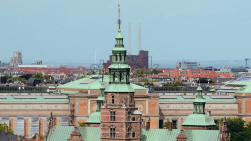 Video - Rosenborg Castle facade towering above traditional red tile roofs in Copenhagen, Denmark