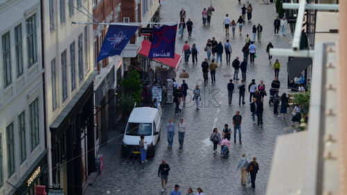 Video - Copenhagen, Denmark - August 3, 2025: European urban street featuring old city architecture and people walking