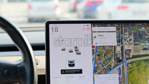 Video - Copenhagen, Denmark - August 4, 2025: Person driving Tesla electric vehicle using an advanced driver assistance system on a highway