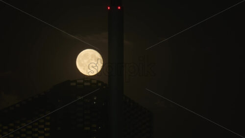 Video - Full moon rising over Copenhill building creating a mysterious atmosphere at night. Copenhagen, Denmark
