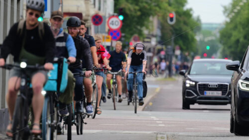 Video - Copenhagen, Denmark - August 5, 2025: Cyclists riding bikes on a city street, illustrating sustainable urban transportation