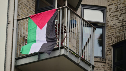 Video - Palestine flag flying on a residential building balcony representing support