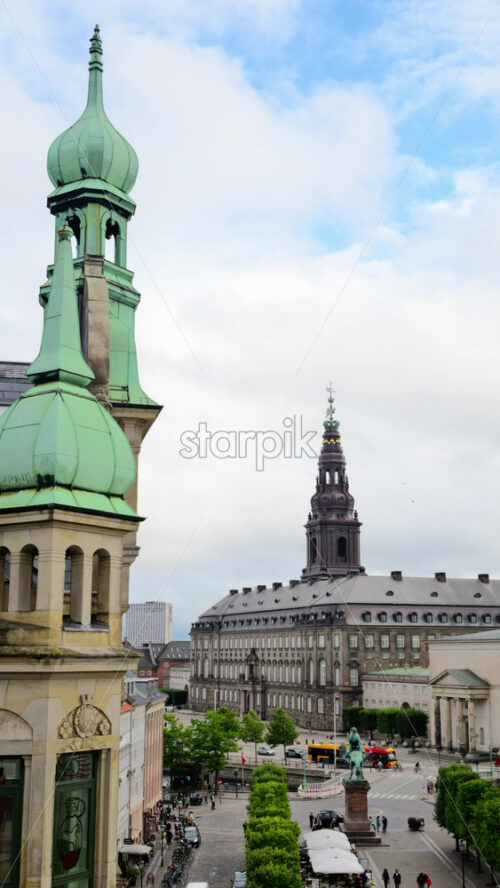 Video - Copenhagen, Denmark - August 6, 2025: Christiansborg Palace tower rising over central Copenhagen and historic buildings