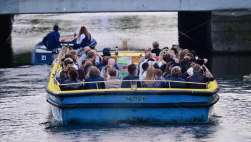 Video - Copenhagen, Denmark - August 2, 2025: Passengers enjoying a canal tour on the boat navigating urban waters