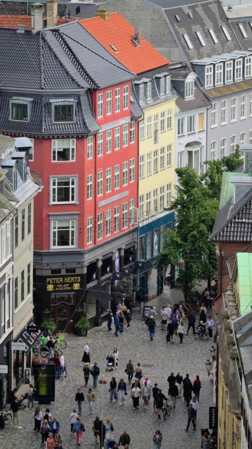 Video - Copenhagen, Denmark - August 7, 2025: People walking on Stroget, Europe's longest pedestrian street, lined with colorful historic buildings