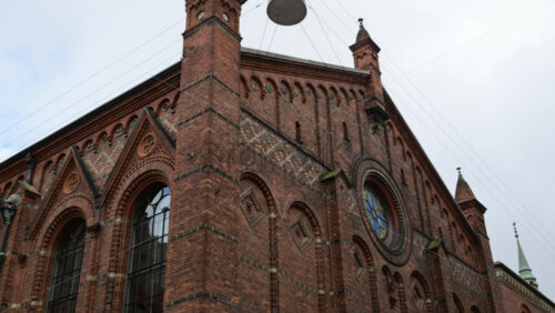 Video - The Old University Library with red brick gothic revival architecture with elaborate details and tall arched windows. Copenhagen, Denmark