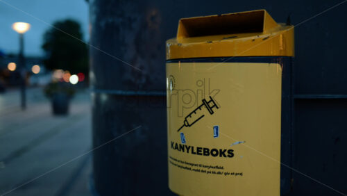 Video - Copenhagen, Denmark - August 3, 2025: Kanyleboks sharps container providing safe disposal of medical needles in an urban setting