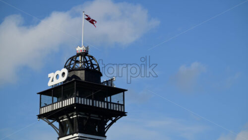 Video - Iconic zoo observation tower flying the flag of Denmark on a clear day. Copenhagen