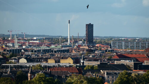 Video - Copenhagen urban skyline showing various architecture and industrial structures under a blue sky. Denmark