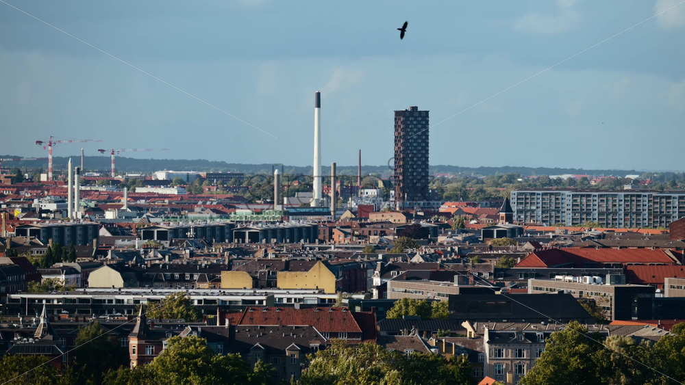 Video - Copenhagen urban skyline showing various architecture and industrial structures under a blue sky. Denmark