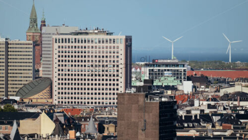 Video - Copenhagen, Denmark - August 4, 2025: Copenhagen cityscape with wind turbines representing sustainability